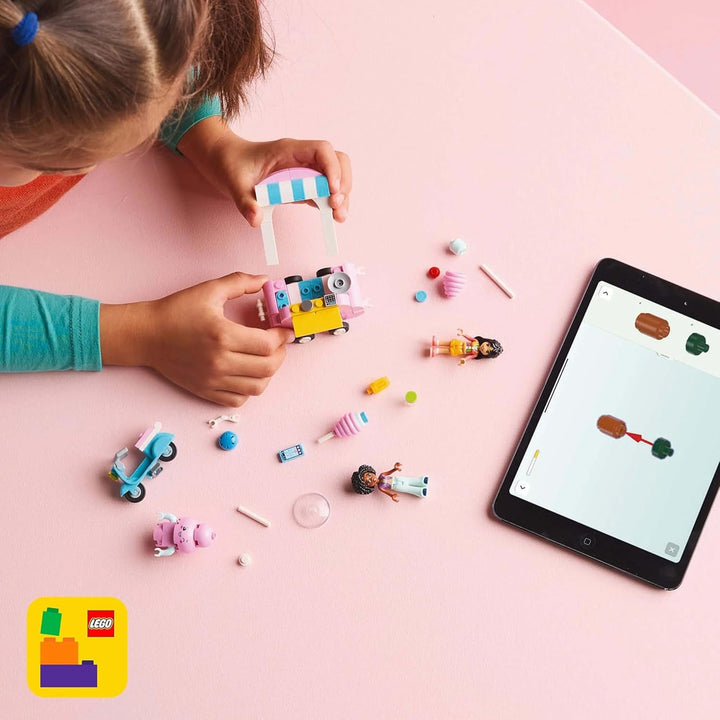 Suport pentru vată de zahăr LEGO Friends, set de joacă pentru jocuri de rol creative cu 2 minifigurine, suport mobil și accesorii, cadou pentru fete de la 6 ani, set de construcție cu mini păpuși 42643